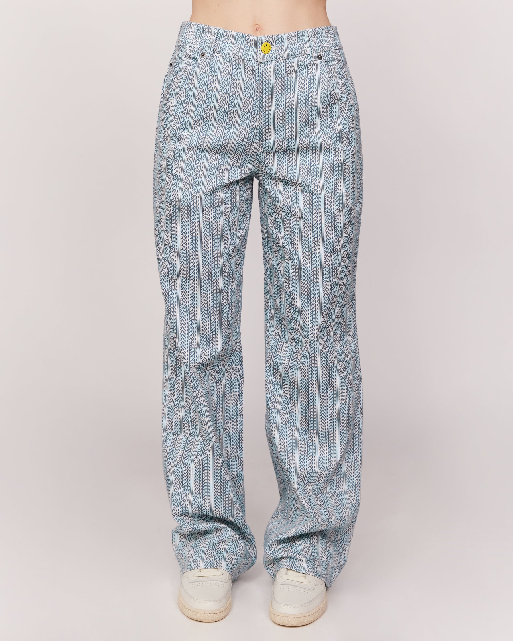 checkered pants with smiley face patch