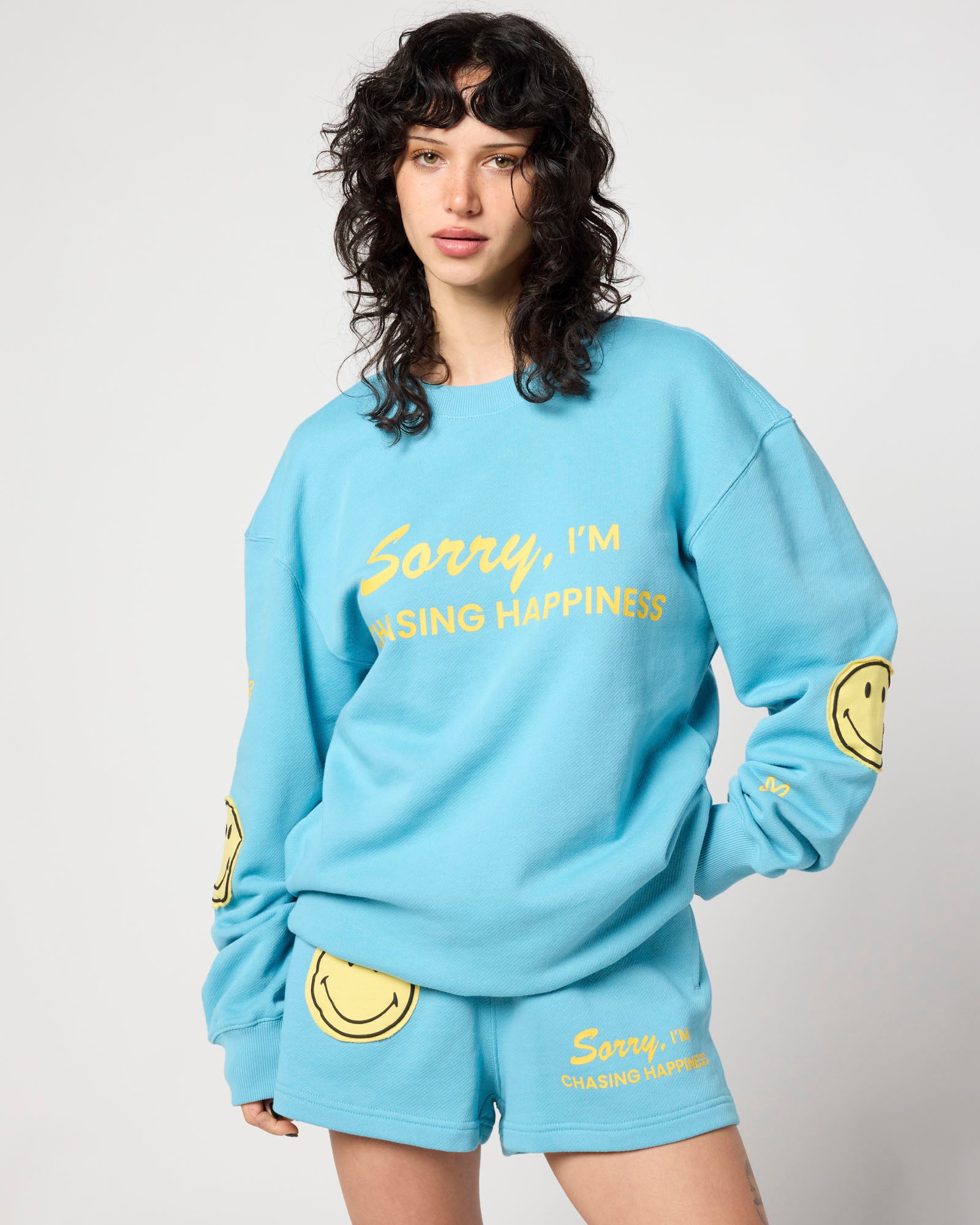 Smiley Chasing Happiness Crewneck