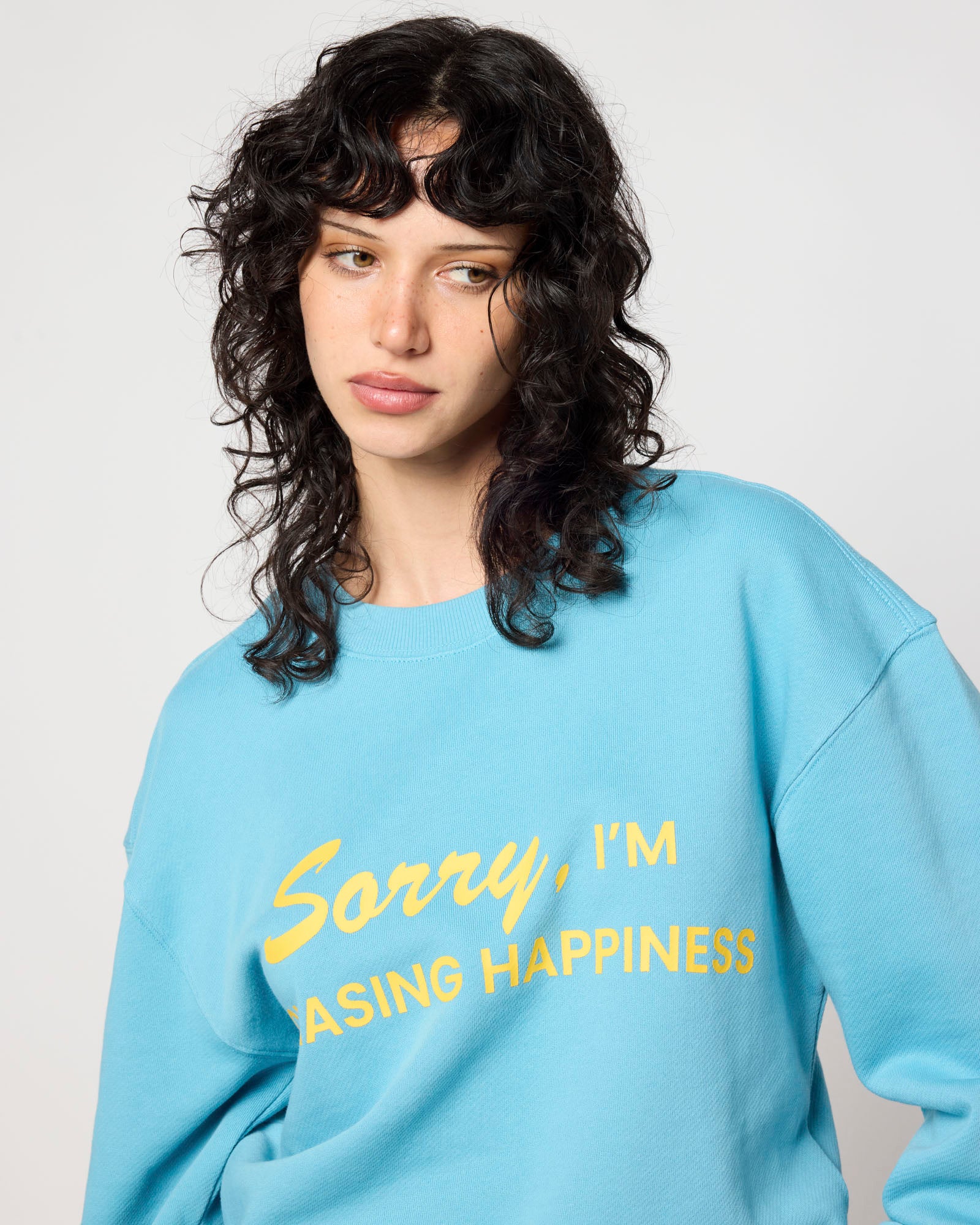 Smiley Chasing Happiness Crewneck