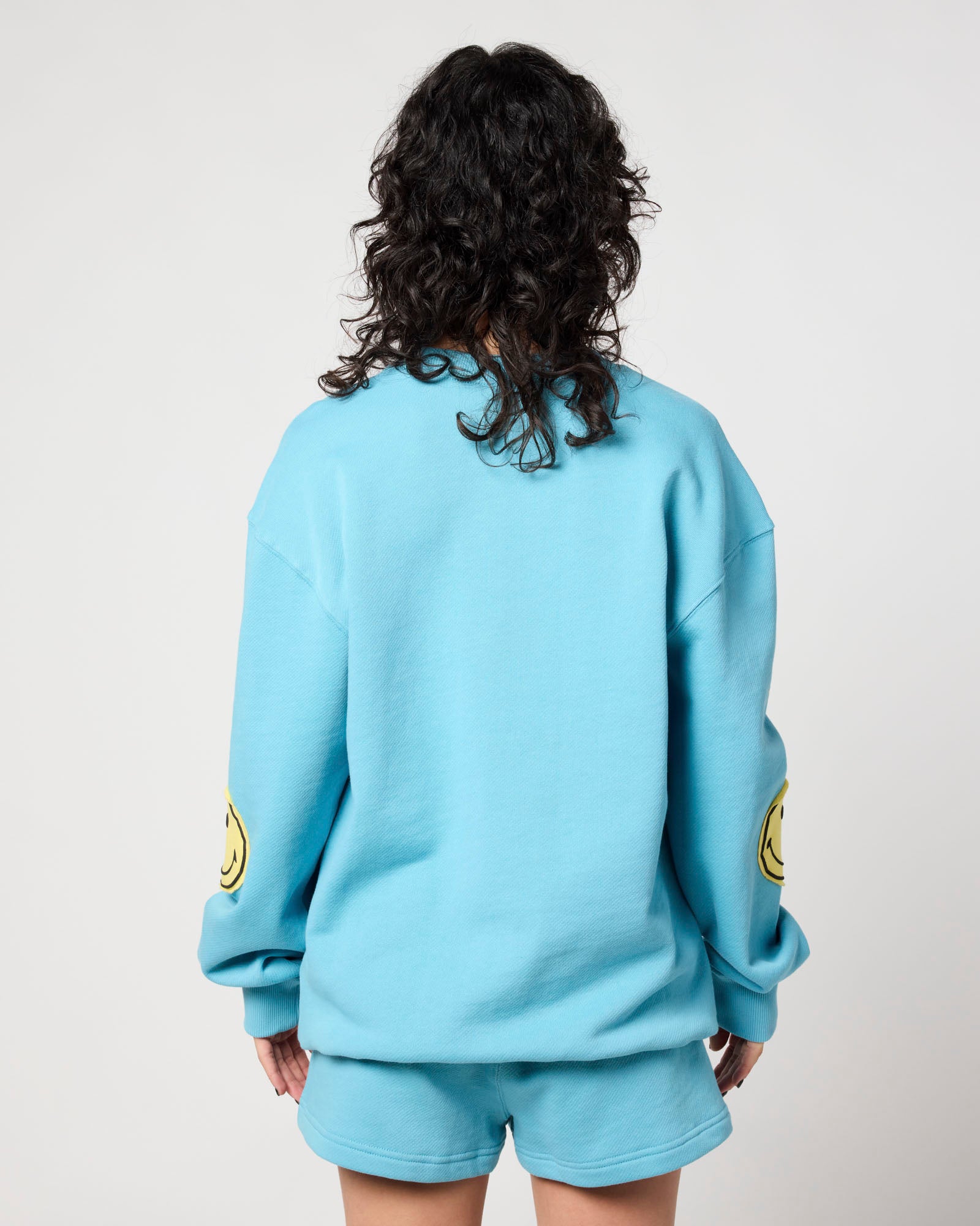 Smiley Chasing Happiness Crewneck