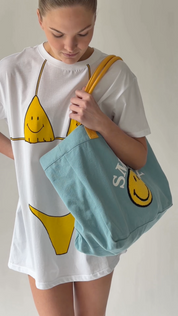 Smiley Chasing Happiness Tote Bag