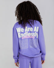 purple crewneck with graphic