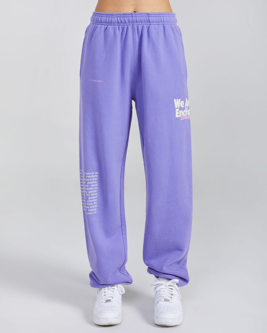 purple sweatpants with evolving graphic