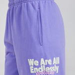 purple sweatpants with evolving graphic