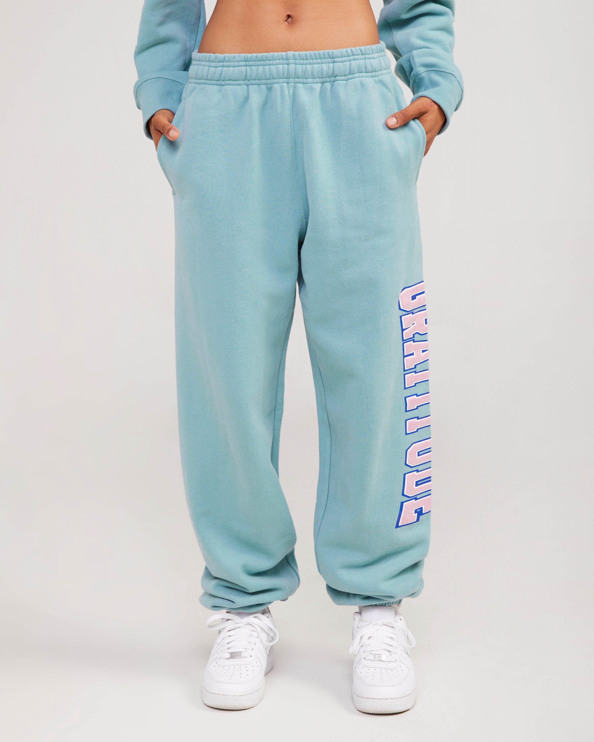 teal sweatpants with gratitude graphic
