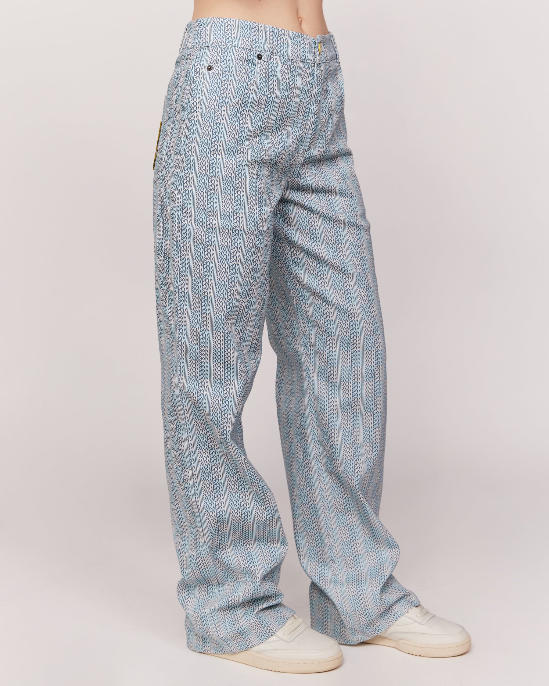 checkered pants with smiley face patch