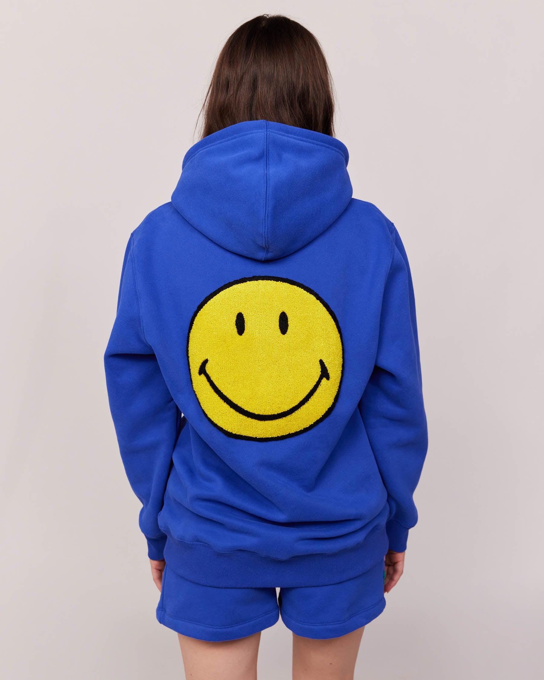 blue smiley hoodie with patches