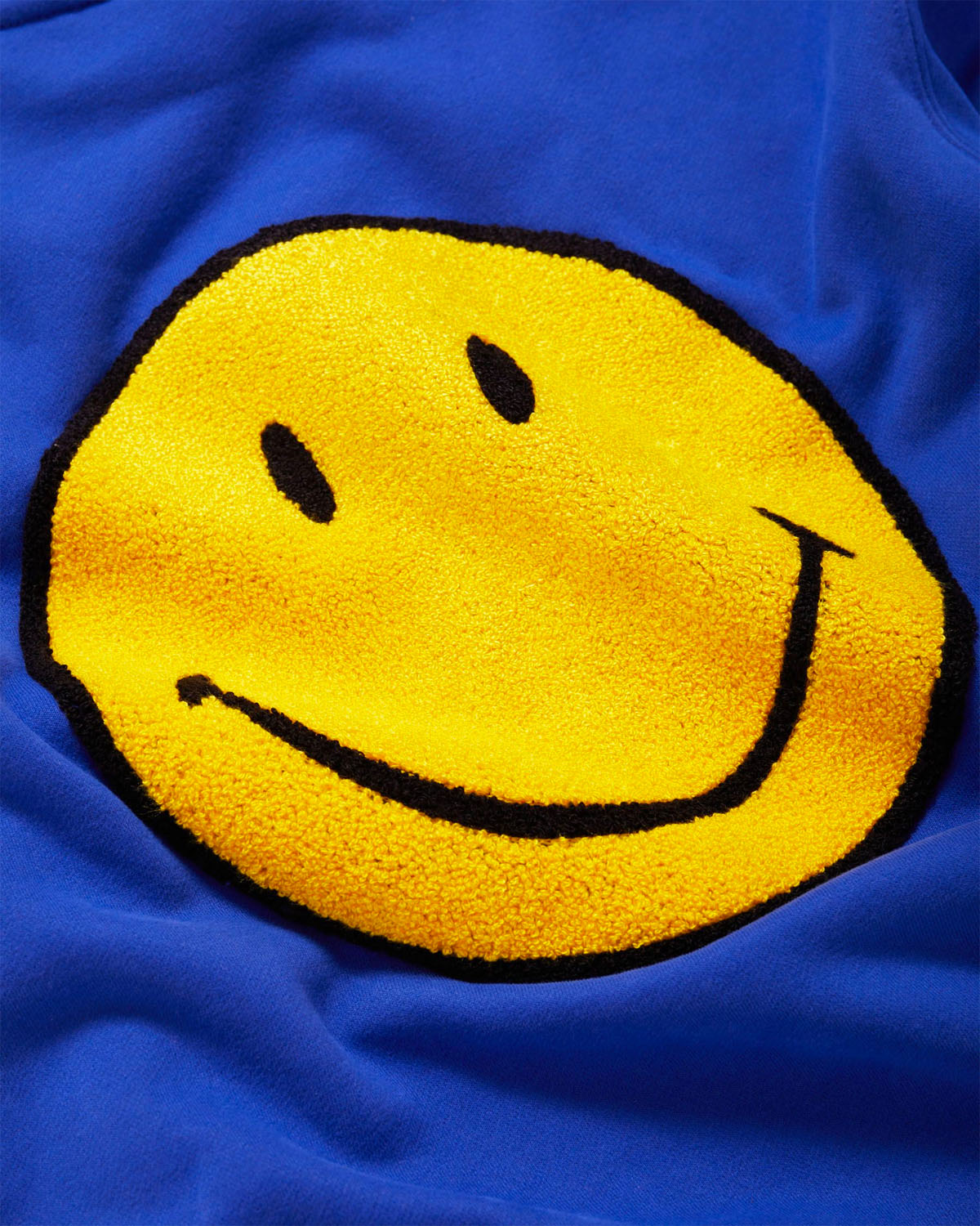 blue smiley hoodie with patches